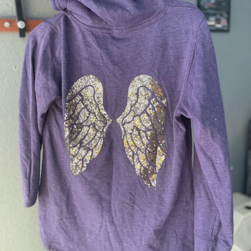 Purple Victoria’s Secret hoodie sweater with angel wings on back. V neck front